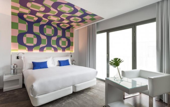 Slaapkamer van hotel Room Mate Carla in Barcelona